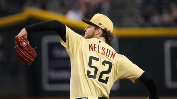 Sep 18, 2022; Phoenix, Arizona, USA; Arizona Diamondbacks starting pitcher Ryne Nelson (52) pitches against the San Diego Padres during the first inning at Chase Field. Mandatory Credit: Joe Camporeale-USA TODAY Sports